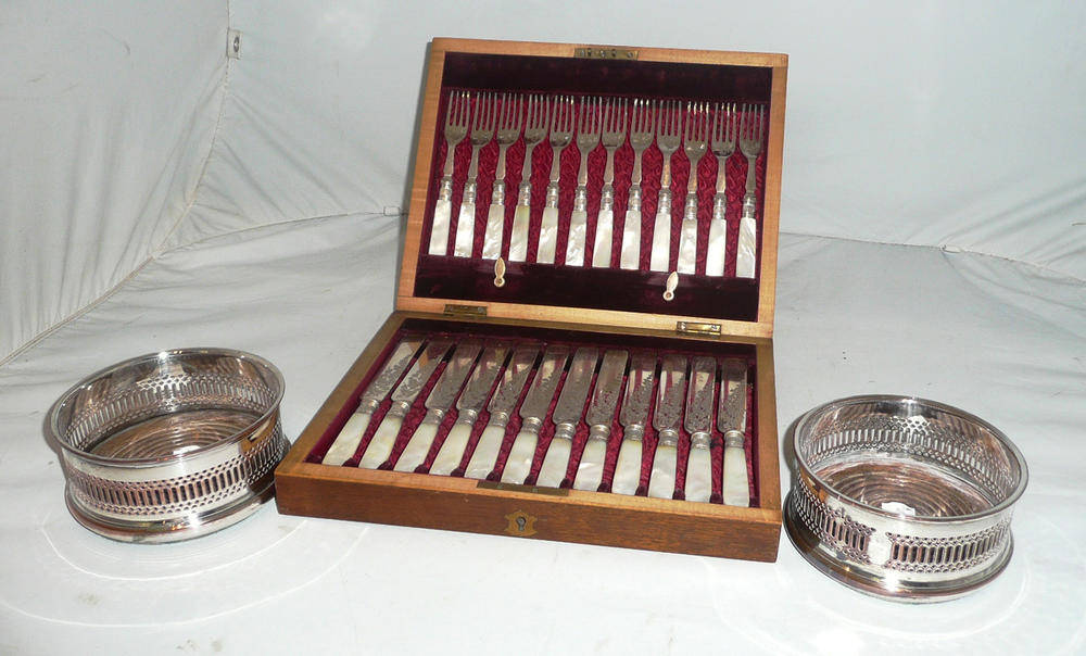 Lot 178 - A pair of plated bottle coasters and a set of twelve mother-of-pearl handled cake knives and...