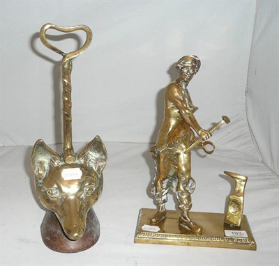 Lot 193 - Brass fox's mask doorstop and a brass figure of a blacksmith