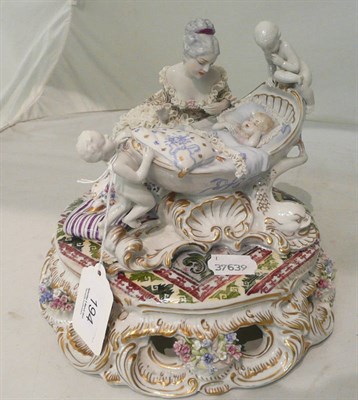 Lot 194 - Continental porcelain group - lady with a sleeping baby