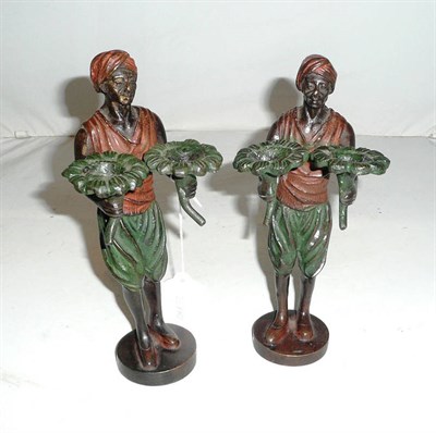 Lot 218 - Pair of figural candlesticks casted as middle eastern men, stamped F. Bergmann 1882