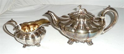 Lot 223 - William IV melon fluted teapot, greyhound finial and milk jug, 35ozs, London 1831