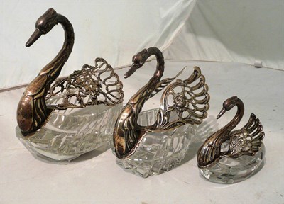 Lot 228 - A set of three Continental silver and cut glass graduated swan baskets