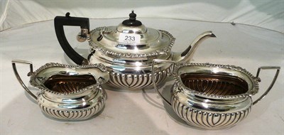 Lot 233 - Silver three piece tea set, 34.5oz