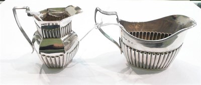 Lot 243 - Silver cream jug and a silver jug