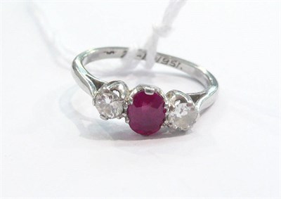 Lot 259 - A ruby and diamond three stone ring