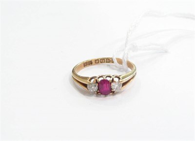 Lot 261 - An 18ct gold, ruby and diamond three stone ring