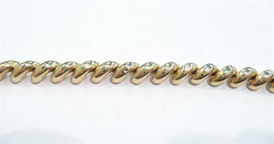 Lot 281 - A fancy link bracelet stamped '14K'