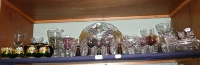 Lot 294 - Shelf of glass ware, including fruit bowl, coloured glass, ships decanter, dessert set etc