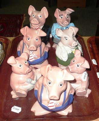 Lot 312 - A set of five Wade Nat West piggy banks and two others