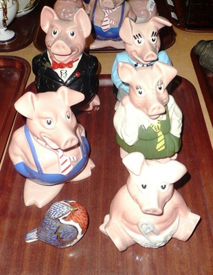 Lot 313 - A Royal Crown Derby 'Robin' paperweight, a set of five Wade Nat West piggy banks and a birthday...