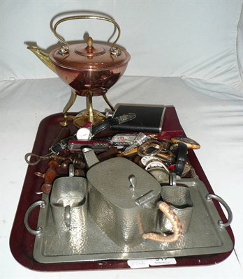 Lot 317 - A tray including an Arts & Crafts copper and brass kettle on stand, assorted corkscrews, pen knives