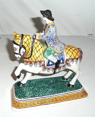 Lot 325 - Faience horse and rider