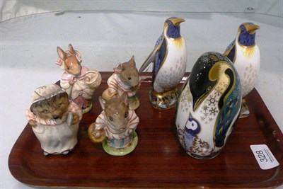 Lot 328 - Three Royal Crown Derby penguins and four Beatrix Potter ornaments (a.f.)