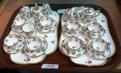 Lot 339 - A pair of Minton miniature tea sets on trays