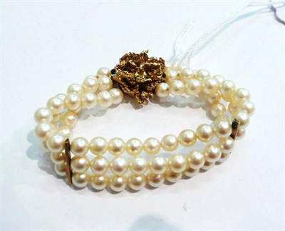 Lot 372 - Pearl three row bracelet with 9ct gold clasp