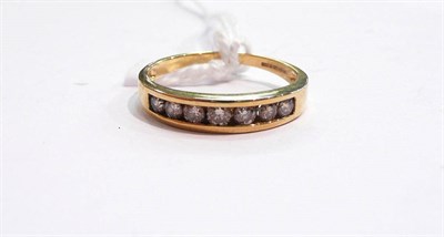 Lot 381 - An 18 carat gold diamond half eternity ring in a channel setting