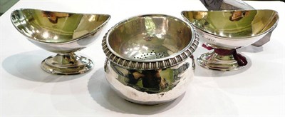 Lot 387 - Pair of silver salts and a silver strainer and base