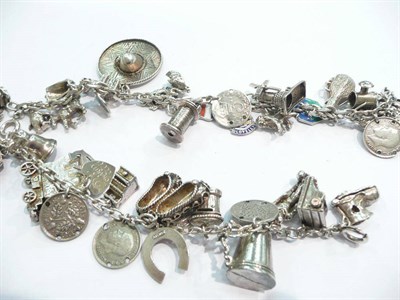 Lot 396 - A double silver charm bracelet