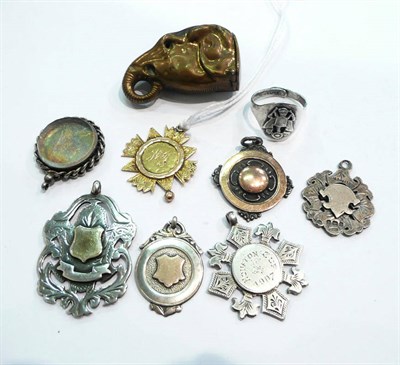 Lot 409 - A 9ct gold fob medallion, six other silver fobs, a ring and a brass elephant head vesta case