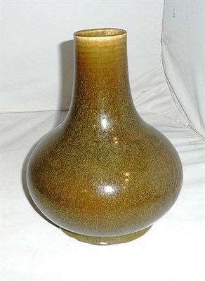 Lot 448 - A teadust glazed bottle vase, 19th century (drilled)