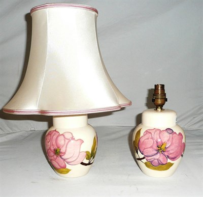 Lot 453 - A pair of Walter Moorcroft 'Magnolia' table lamps