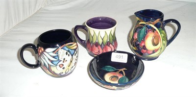 Lot 491 - A Moorcroft 'Queens Choice' 201/4 peach dish, a Moorcroft 'Apollo' cup, a Moorcroft 'April...