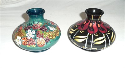 Lot 497 - A Moorcroft 'Night Rose' squat vase and a Moorcroft 'Centenary Carousel' squat vase