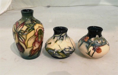 Lot 511 - A Moorcroft 'Meadow Charm' miniature squat vase, a Moorcroft 'Nivalis' miniature squat vase and...