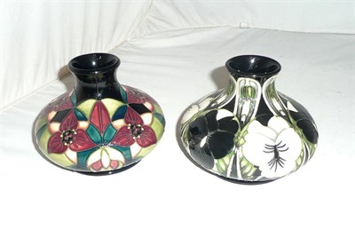 Lot 512 - A Moorcroft 'Trillium' 35/5 vase designed by Nicola Slaney, (second) and a Moorcroft 'Harlequinade'