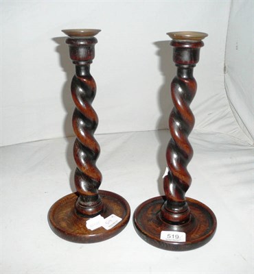 Lot 519 - Pair of oak candlesticks