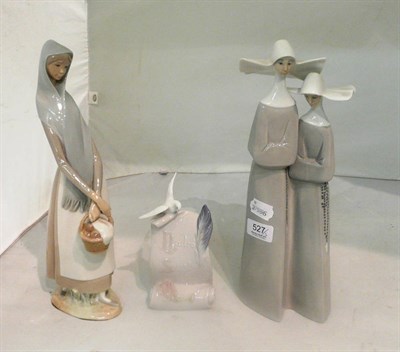 Lot 527 - Lladro group modelled as two nuns, Lladro girl with basket and a Lladto society plaque (3)