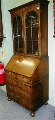 Lot 639 - Reproduction walnut bureau bookcase