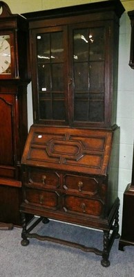 Lot 649 - An oak bureau bookcase