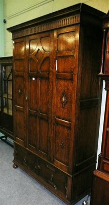 Lot 651 - Early 20th century oak wardrobe