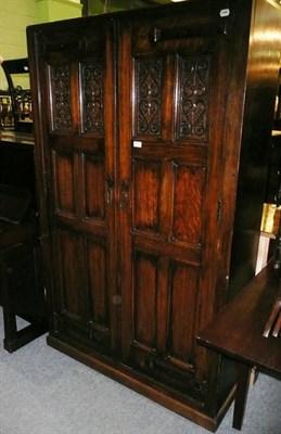 Lot 659 - Arts & Crafts oak hall wardrobe labelled 'S J Waring & Sons'