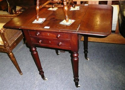 Lot 683 - A mahogany patience table on turned supports