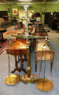 Lot 686 - A large set of brass weighing scales and weights