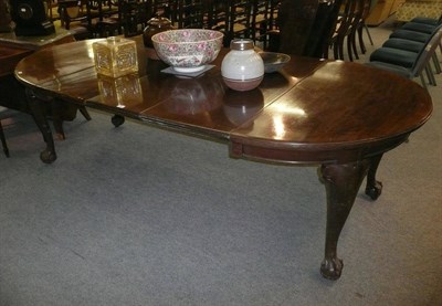 Lot 695 - Mahogany wind action table with three leaves