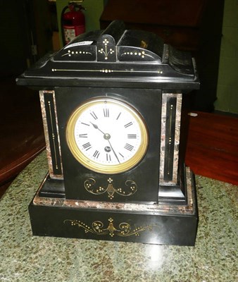 Lot 698 - A black slate and marble mantel timepiece