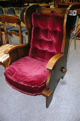 Lot 700 - An oak panelled back chair