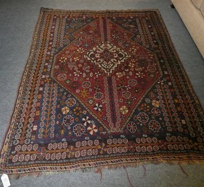 Lot 712 - Kashgai rug, South West Persia, the stepped lozenge shaped medallion enclosed by indigo spandrels