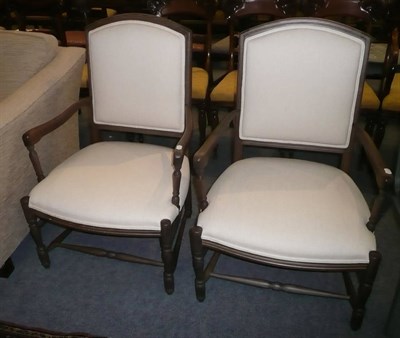 Lot 713 - Pair of cream upholstered open armchairs