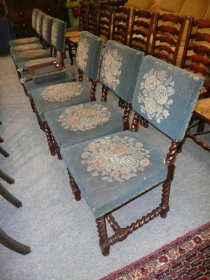 Lot 720 - Eight oak barley twist dining chairs upholstered in blue flower pattern