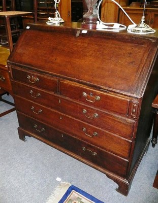 Lot 745 - A Georgian oak bureau