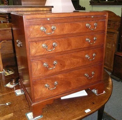 Lot 763 - Reproduction four height chest of drawers with brushing slide