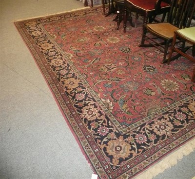 Lot 832 - A red ground rug