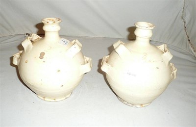 Lot 3 - A pair of 19th century Continental white glazed pottery harvest flasks