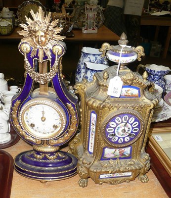 Lot 28 - A French lyre clock and a spelter and porcelain mounted striking mantel clock (2)