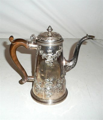 Lot 43 - An early Georgian coffee pot with later Victorian repouse decoration, 22oz