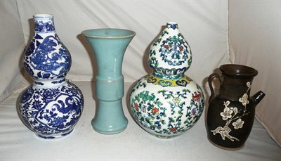 Lot 44 - Blue and white gourd vase, Chinese gourd vase, pouring vessel and a blue vase